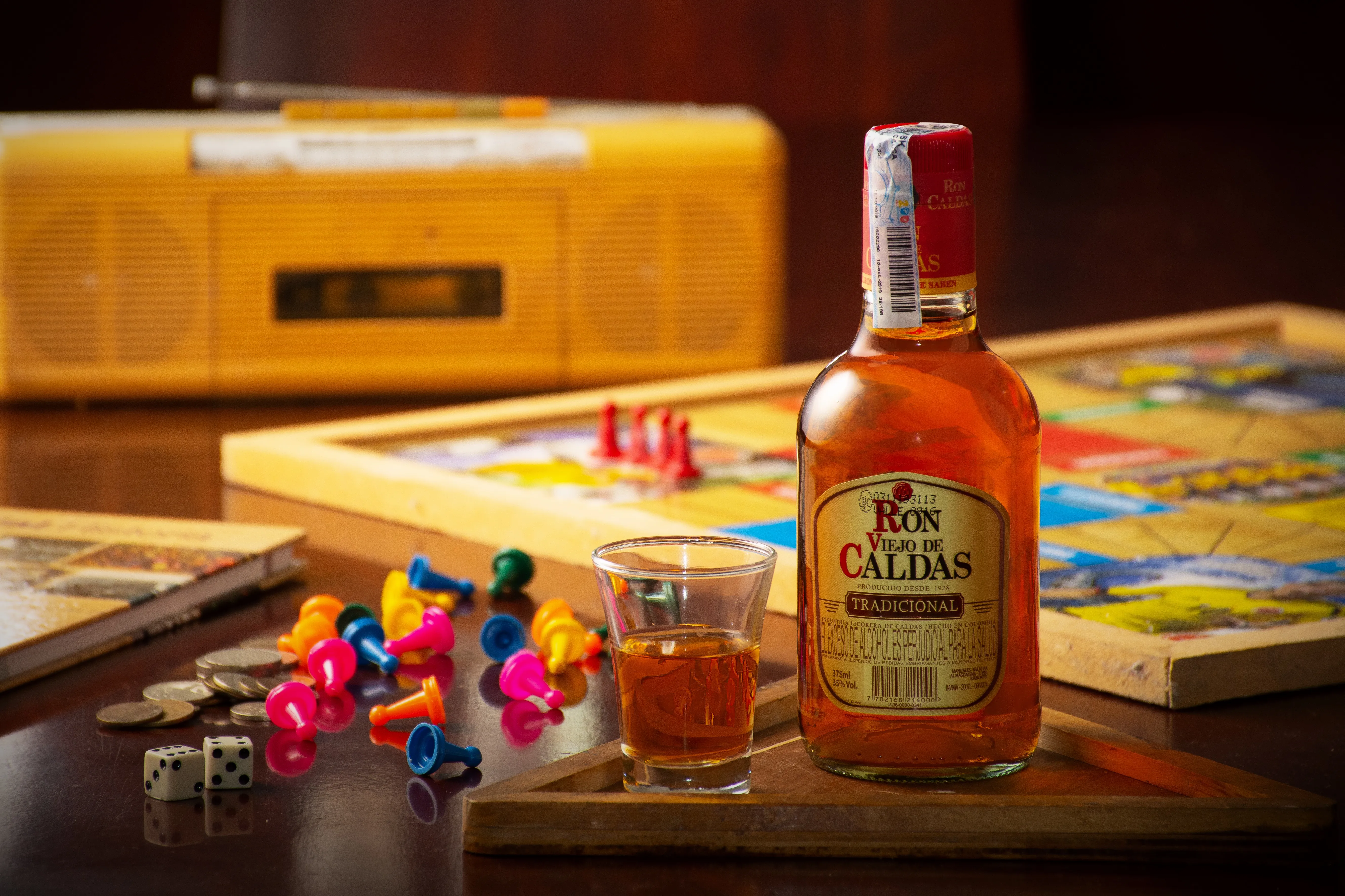 Ron Caldas Rum Bottle Board Games Vintage Radio Houston - Food & Product Photography in Houston Texas
